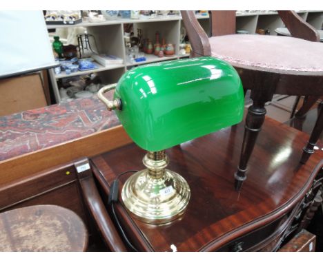 A modern brass and green glass students lamp