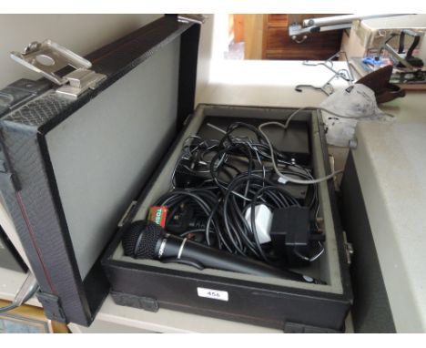 A vintage hard case of radio mics etc