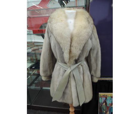 A ladies vintage sapphire mink 3/4 length coat having blue fox shawl collar and grey leather belt and trim