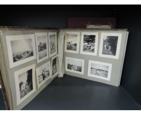 Two albums containing vintage postcards, sketches, photographs and ephemera