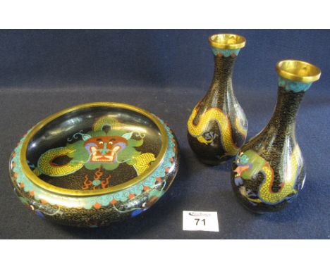 Two similar Chinese cloisonne dragon vases, together with a squat baluster bowl of similar dragon design, all on black ground