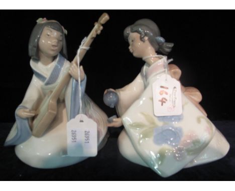 Two Nao Spanish porcelain figurines, oriental style of a girl making a cup of tea and another with musical instrument. (2)(B.