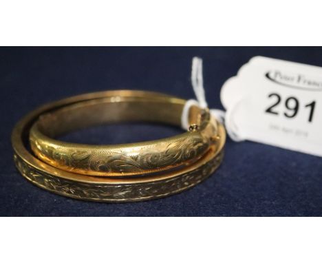 9ct gold engraved slave bangle and a 9ct gold engraved bangle.(B.P. 24% incl. VAT) CONDITION REPORT: Weight - 30g approx