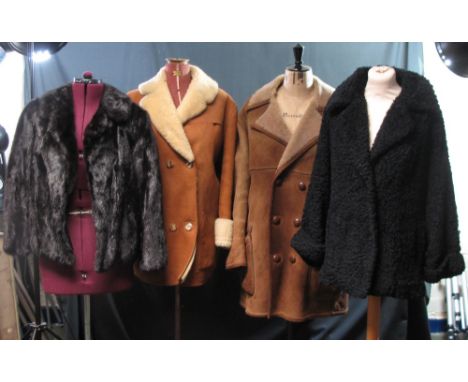 Two vintage sheepskin coats including: a light brown one with a leather craft Ltd. label and a black one with Wetherall Bond 