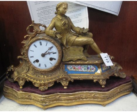 19th Century French ormolu figural mantel clock having Roman enamel face, French porcelain floral panel on a wooden gilded ba