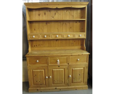 Modern pine dresser having fitted spice drawers with turned ceramic, blue and white handles.(B.P. 24% incl. VAT)