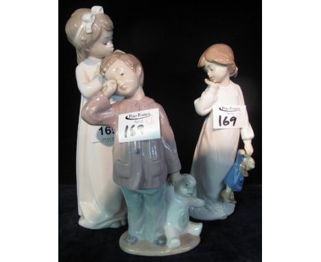 Two Nao Spanish porcelain figurines of young girl with teddy and young boy with teddy, together with a similar Spanish porcel