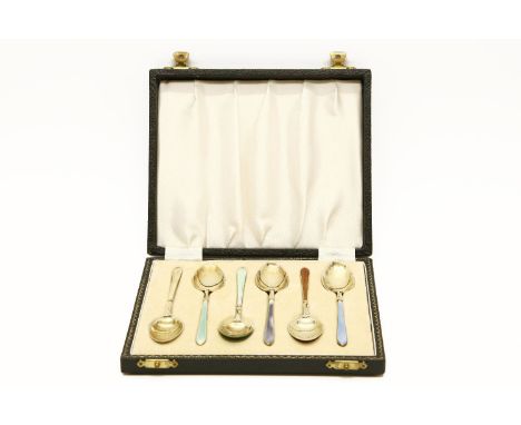 A set of six silver gilt and coloured enamel coffee spoons, by William Suckling, Birmingham 1956, cased