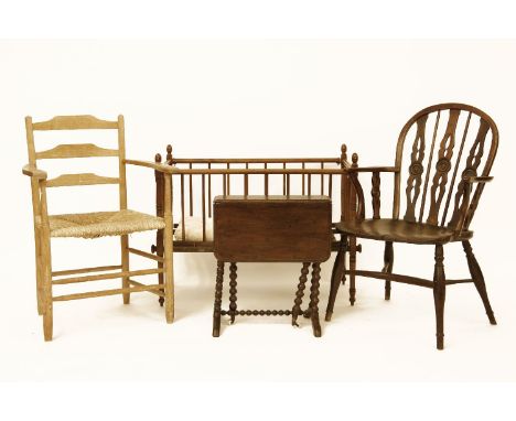 A Thames Valley Windsor chair, by Prior, a rush seat ladder back chair, a child's cot, and a Sutherland table