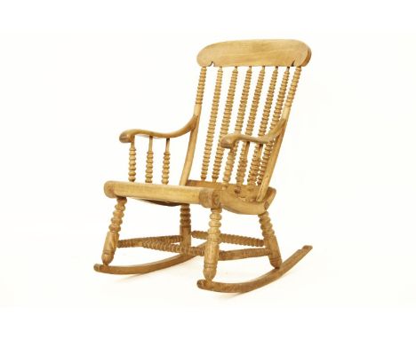 A beechwood bobbin turned rocking chair