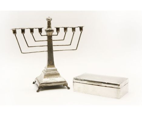 A 20th century silver menorah, marks for Birmingham, 25cm tall, together with a silver cigarette box, with engine turned deco