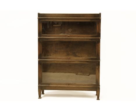 A Globe Wernicke three section oak bookcase on separate base, 86 cm x 28 cm x 120 cm