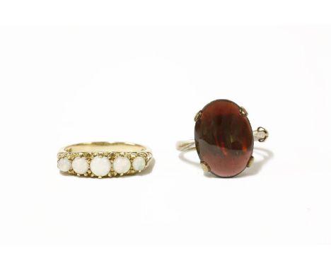 A 9ct gold five stone opal ring, and a 9ct gold garnet cabochon ringOpal 3.40g Garnet 4.75g