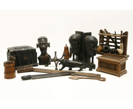 A papier mache tea caddy, together with a small collection of treen and African carvings to include a pipe stand and pipes 