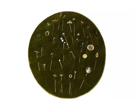 A collection of assorted gold and silver stick pins, to include a diamond cluster stick pin, a gold, diamond and ruby horse s