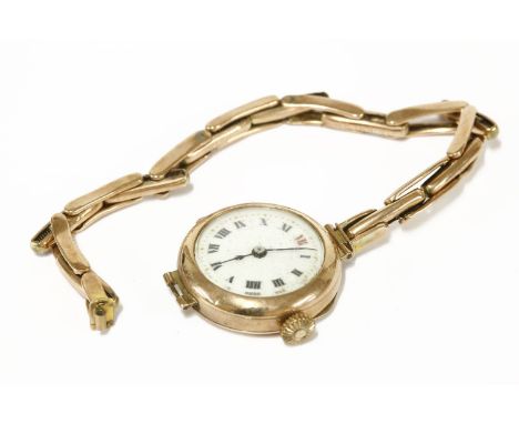 A 9ct gold ladies mechanical watch, with integral 9ct gold expanding bracelet, white enamel dial and Roman numerals18.52g