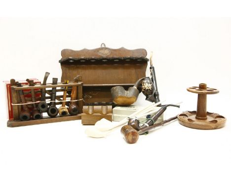 A large collection of pipe racks, and other pipe related items to include lighters