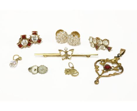 A 9ct gold single stone diamond butterfly bar brooch, a pair of gold red enamel and paste stone earrings (tested as 9ct gold)