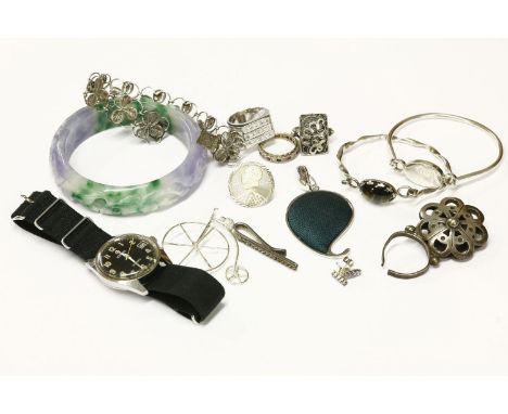 A collection of costume jewellery, a dyed jade carved bangle, a gentleman's stainless steel Roamer Searock mechanical strap w