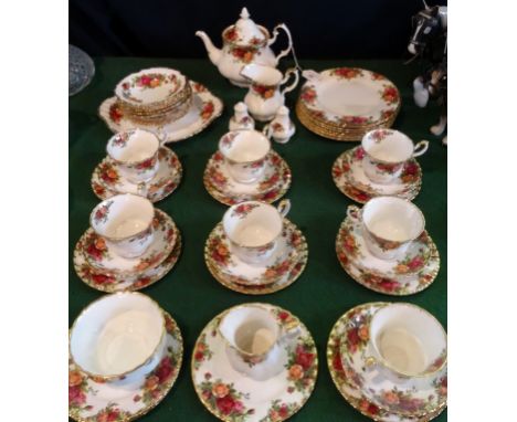 A Royal Albert Old Country Roses part-tea service, a six place setting with extras comprising:  teapot, trios, side plates, s