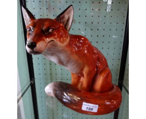 A large Royal Doulton seated fireside fox, HN2634, initialled J. C. (26cm tall). Condition Report: No obvious signs of repair