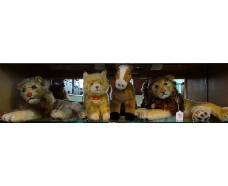 Four mid-20th century Steiff animals and later, to include: two Leo Lions, a Pferd Ferdy horse and a Kitty Cat, each with but
