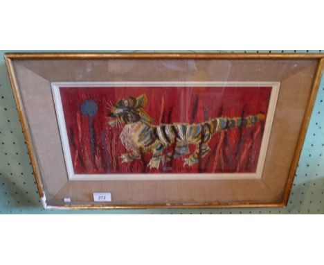 Kaye, an abstract tapestry of a tiger in tall grass (18cm x 40cm), glazed in a gilt frame.