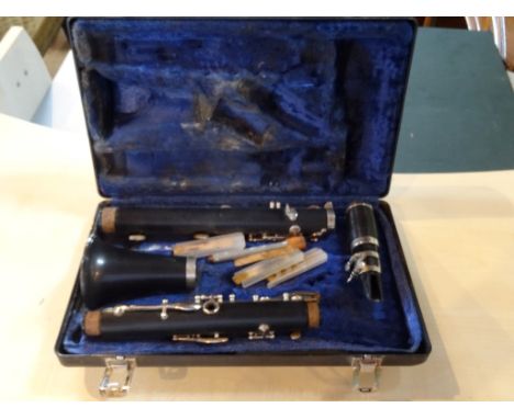 A cased four piece clarinet.