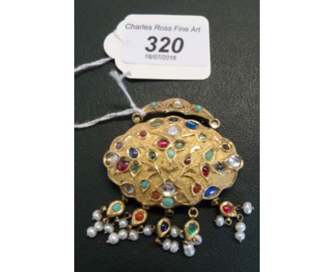 A Jaipur Indian enamelled large yellow metal dress brooch with numerous precious stones and enamel foliate decoration to the 