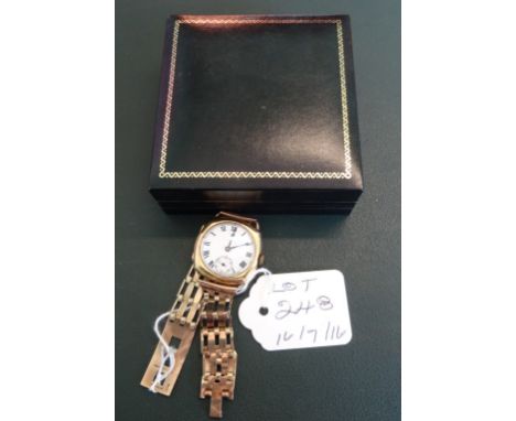 A gentleman's 18 carat yellow gold cased Peerless watch, the hinged cushion shaped case enclosing a white metal Roman dial wi