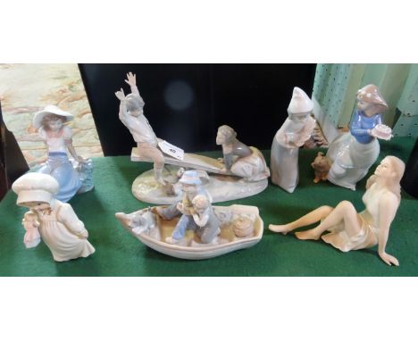 Seven Continental ceramic figurines, to include Nao and Lladro examples.