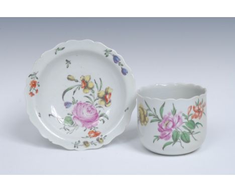 A Worcester petal lobed finger bowl and stand, of typical form,  painted in the Meissen manner,  in soft colours, with sprays