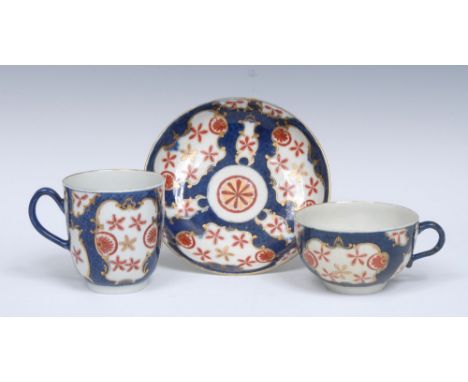 A Worcester Starburst pattern coffee cup, teacup and saucer,  decorated with alternating fan and vase with stylised gilt and 