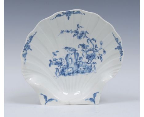 A Worcester Two Peony Rock Bird pattern sweetmeat dish, moulded as a large scallop shell, painted in blue with a bird perched