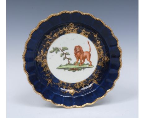 A Worcester The Animal Service lobed circular plate,  in the style of Jeffreys Hamett O'Neale, with a lion standing by a tree