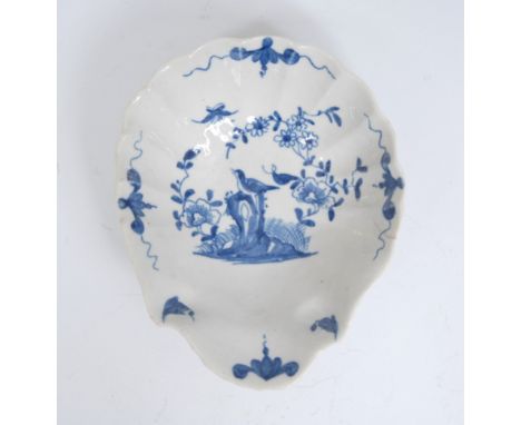 A Worcester Two Peony Rock Bird pattern shell shaped pickle dish, painted in blue with a bird perched on a tall pierced rock 