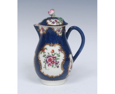 A Worcester pear shaped milk jug and cover,  painted with colourful garlands of flowers suspended within scrolling gilt carto