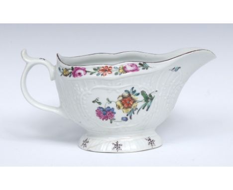 A Worcester strap fluted sauce boat,  painted with brightly coloured flower sprays, panels edged with leafy sprays and scroll