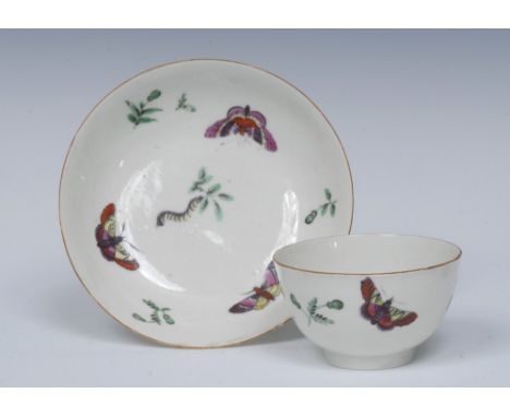 A Worcester rare tea bowl and saucer, painted  with a series of colourful fancy insects among leaf and bud sprigs in green mo