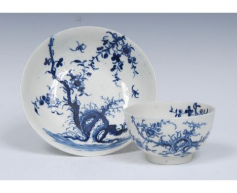 A Worcester Prunus Root pattern tea bowl and saucer, well painted in cobalt blue with scrolling branches and foliage, workman