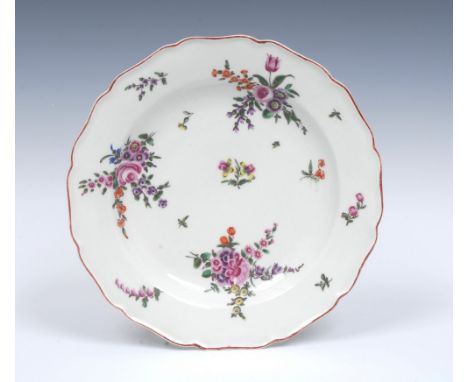 A Worcester shaped circular plate, possibly early James Giles,  painted with scattered sprigs and three colourful formal bouq