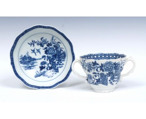 A Worcester Fence pattern ogee shaped chocolate cup and saucer, serpent handles,  printed in underglazed blue with fence, chr