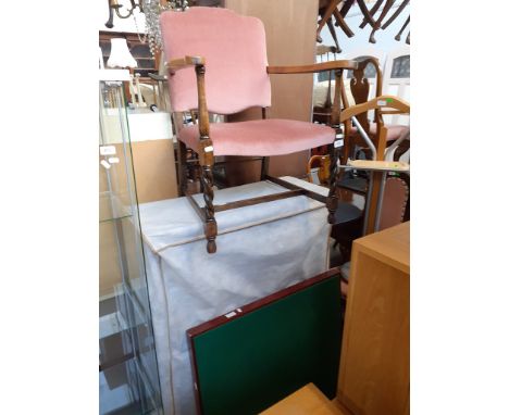 An oak armchair and a folding card table 