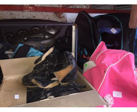 A pair of rollerblades, a pair of ski boots and 2 pairs of vintage ice skates. 