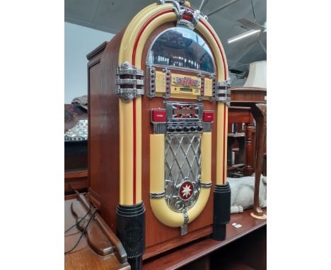 A light up CD juke box, height 101cm, width 56cm and depth 28cm 