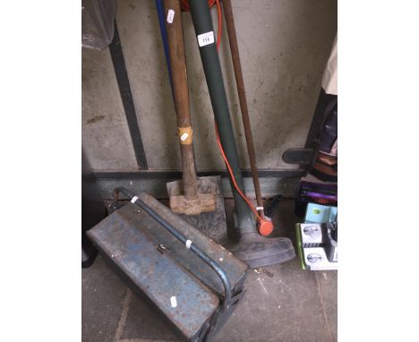 A sledgehammer, a spade, an electric strimmer and a toolbox with contents, etc. 