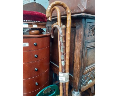 Five vintage walking sticks, some with badges 