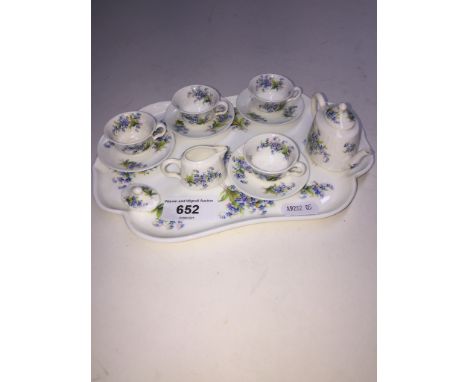 A miniature Minton cabinet tea set decorated in forget-me-nots.Condition: tray length 21.2cm, no signs of any damage or repai