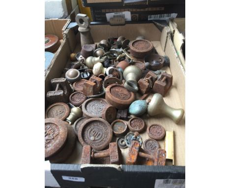 A box containing vintage scale weights 