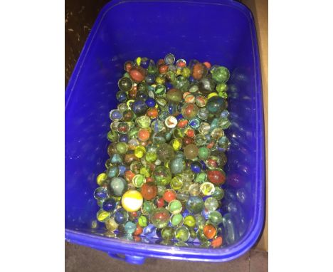 A blue tub of vintage marbles. 